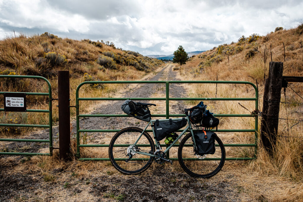 A Pelago gravel bicycle with front rack, frame bag and saddle bag.